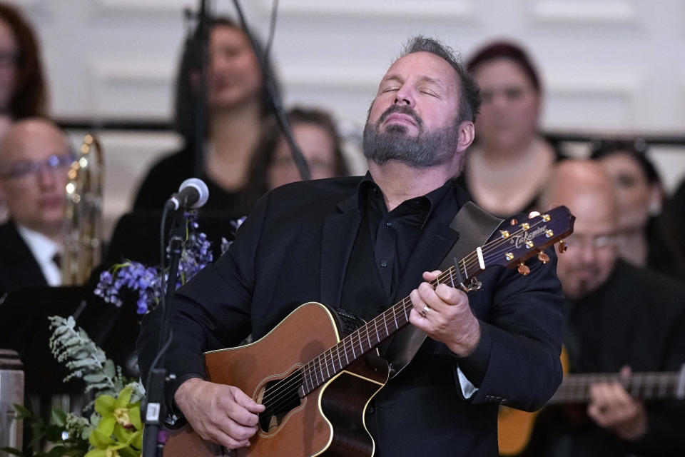 Country music star Garth Brooks performs during a tribute service for former first lady Rosalynn Carter at Glenn Memorial Church, in Atlanta, Tuesday, Nov. 28, 2023. Fellow Habitat for Humanity ambassadors Brooks and his wife Trisha Yearwood performed a rendition of "Imagine". (AP Photo/Brynn Anderson)