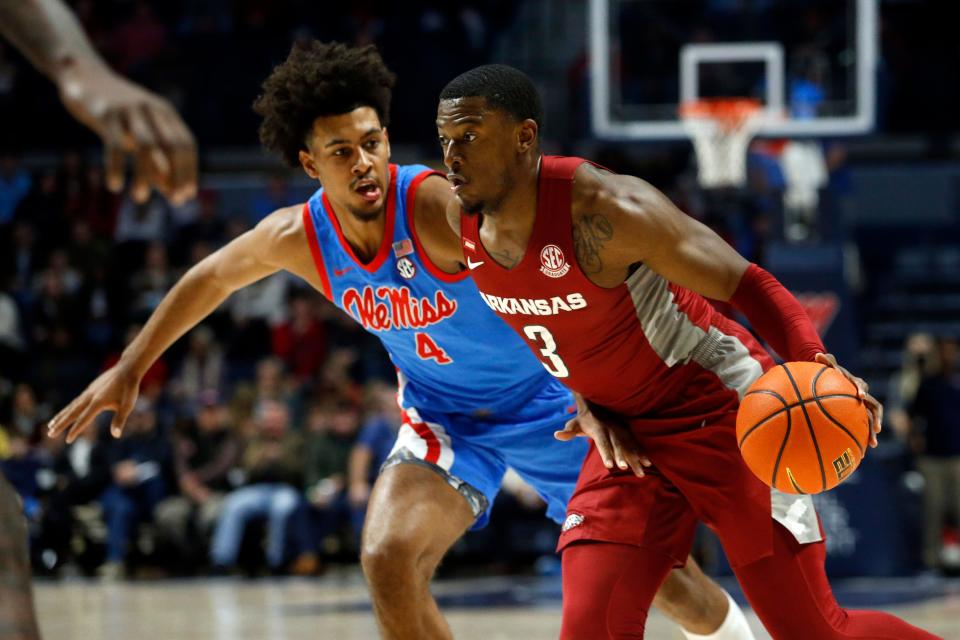 Jan 26, 2022; Oxford, Mississippi, USA; Arkansas Razorbacks forward Trey Wade (3) drives to the basket as Mississippi Rebels forward Jaemyn Brakefield (4) defends during the first half at The Sandy and John Black Pavilion at Ole Miss. Mandatory Credit: Petre Thomas-USA TODAY Sports