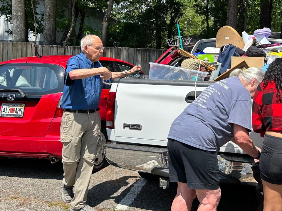 Local humanitarian, Ken Boutwell, helps load trucks on World Refugee Day.