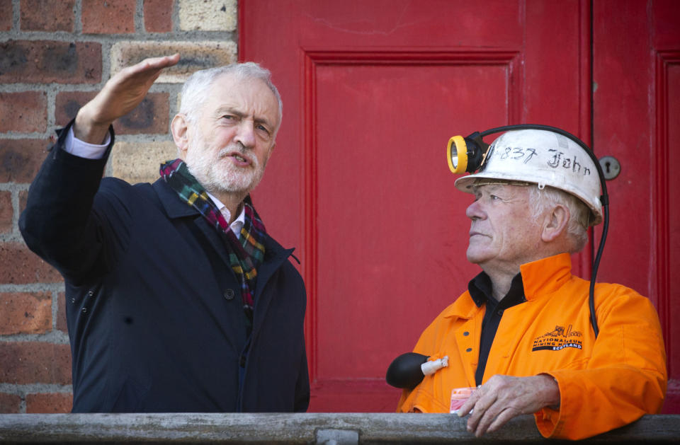 Britain's Labour Party Jeremy Corbyn meets former miner John Kane at the National Mining Museum at the former Lady Victoria Colliery in Newtongrange, Scotland, Thursday Nov, 14, 2019, on the General Election campaign trail. (Jane Barlow/PA via AP)