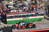 NEW DELHI, INDIA - MARCH 28: Migrant workers are seen on a bus to go their native villages during nationwide lockdown as a precaution against coronavirus (COVID-19) pandemic, in New Delhi, India on March 28, 2020. (Photo by Amarjeet Kumar Singh/Anadolu Agency via Getty Images)