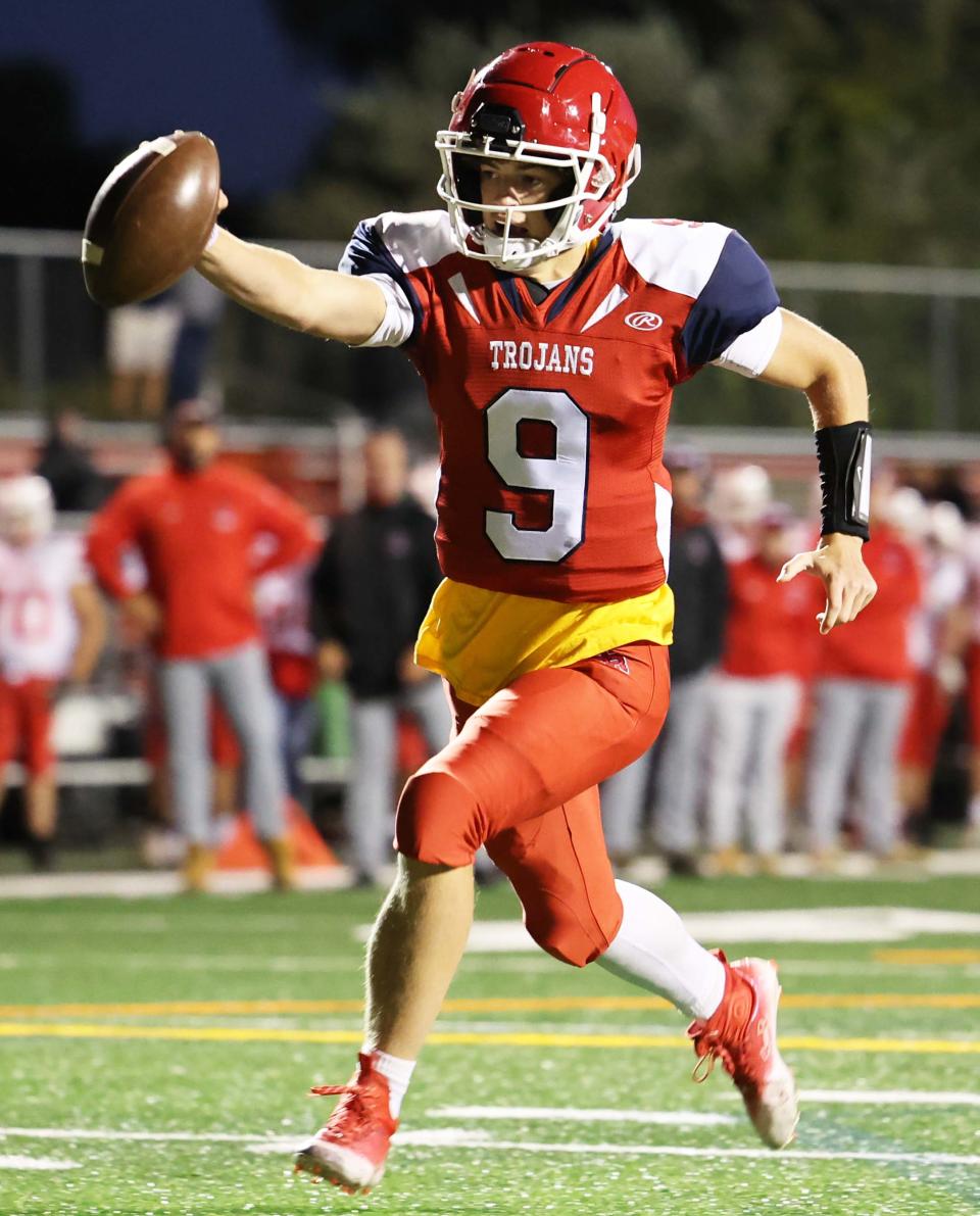 Bridgewater-Raynham quarterback Declan Byrne scores a touchdown during a game versus Barnstable on Friday, Sept. 23, 2022.  