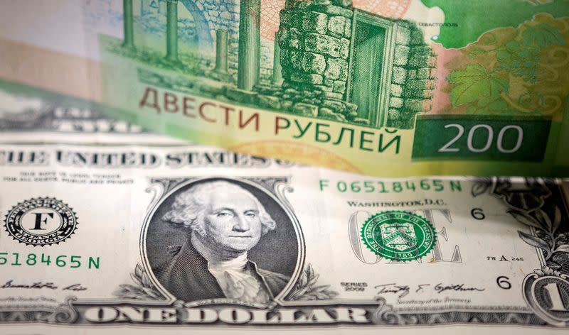 Illustration shows Russian Rouble and U.S. Dollar banknotes