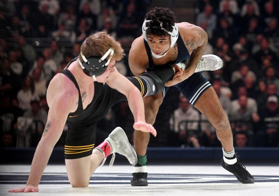 Penn State's Roman Bravo-Young controls Iowa's Brody Teske at 133 pounds Friday, Jan. 27, 2023, in State College, Pa.