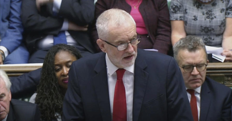 Britain's Labour Party leader Jeremy Corbyn responds to Prime Minister Boris Johnson's statement to lawmakers inside a crowded House of Commons in London, Saturday Oct. 19, 2019. At a rare weekend sitting of Parliament, Johnson implored legislators to ratify the Brexit deal he struck this week with the other 27 EU leaders. (House of Commons via AP)