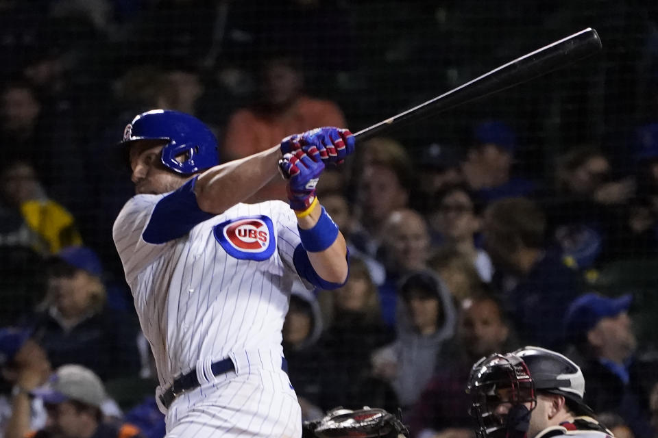 Chicago Cubs' Patrick Wisdom watches his two-run single off Minnesota Twins relief pitcher Jorge Alcala during the sixth inning of a baseball game Tuesday, Sept. 21, 2021, in Chicago. (AP Photo/Charles Rex Arbogast)