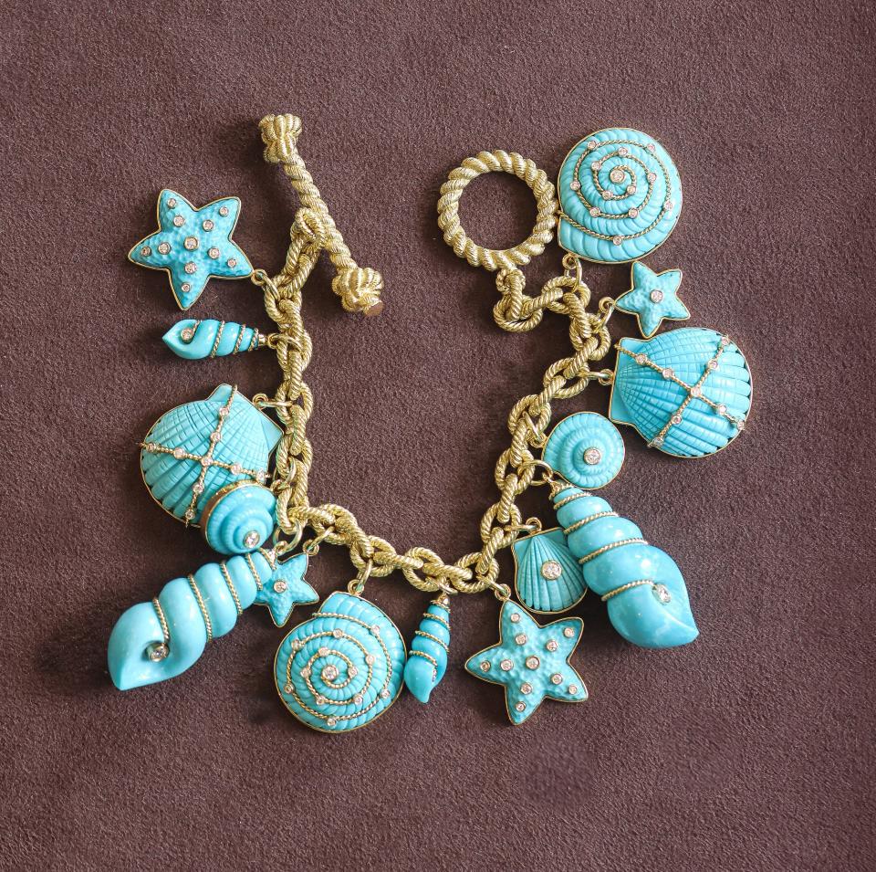 This cabana charm bracelet is handcrafted out of turquoise by Italian artisans.