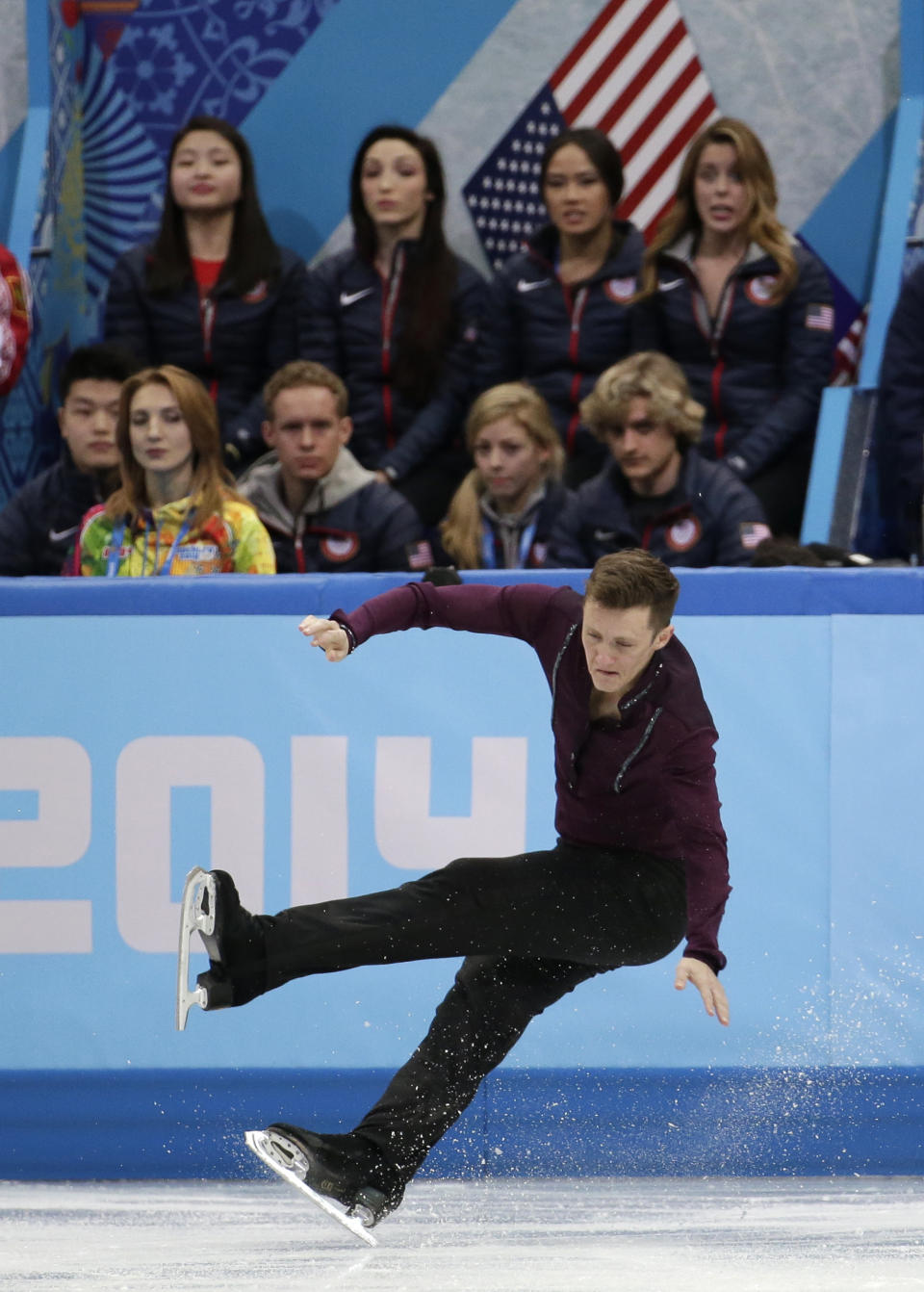 Jeremy Abbott of the United States falls as he competes in the men's team short program figure skating competition at the Iceberg Skating Palace during the 2014 Winter Olympics, Thursday, Feb. 6, 2014, in Sochi, Russia. (AP Photo/Bernat Armangue)