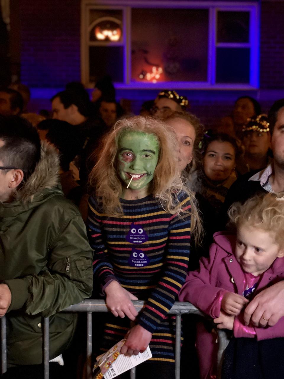 Freya Hobbs and her family watch the Village Halloween Parade in New York City on Oct. 31, 2017.