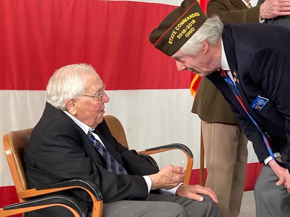 Medina County resident Leonard Giorgio, left, speaks with David K. Root, past president of the Ohio Department of the Veterans of Foreign Wars. Giorgio received the French Legion of Honor on Saturday in recognition of his service in France during World War II.