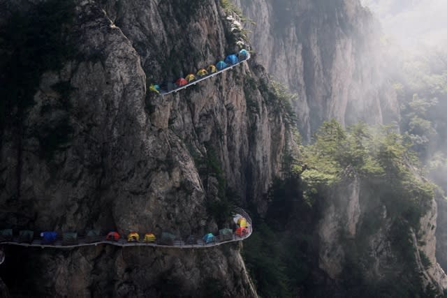 Tourists set up camp on 1,700m high cliff edge