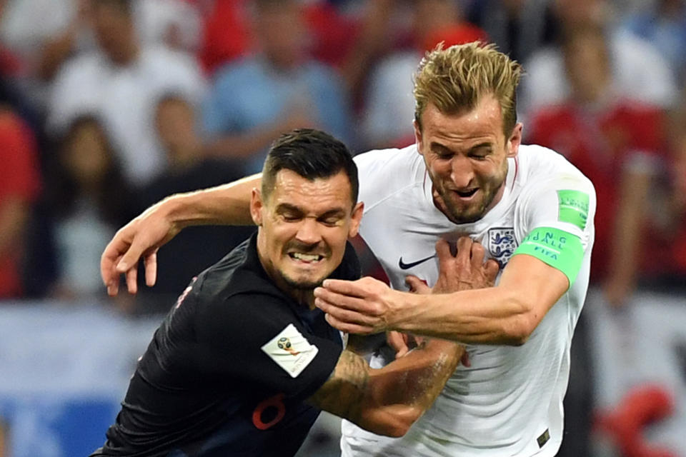 <p>Croatia’s defender Dejan Lovren (L) challenges England’s forward Harry Kane during the Russia 2018 World Cup semi-final football match between Croatia and England at the Luzhniki Stadium in Moscow on July 11, 2018. (Photo by YURI CORTEZ / AFP) </p>