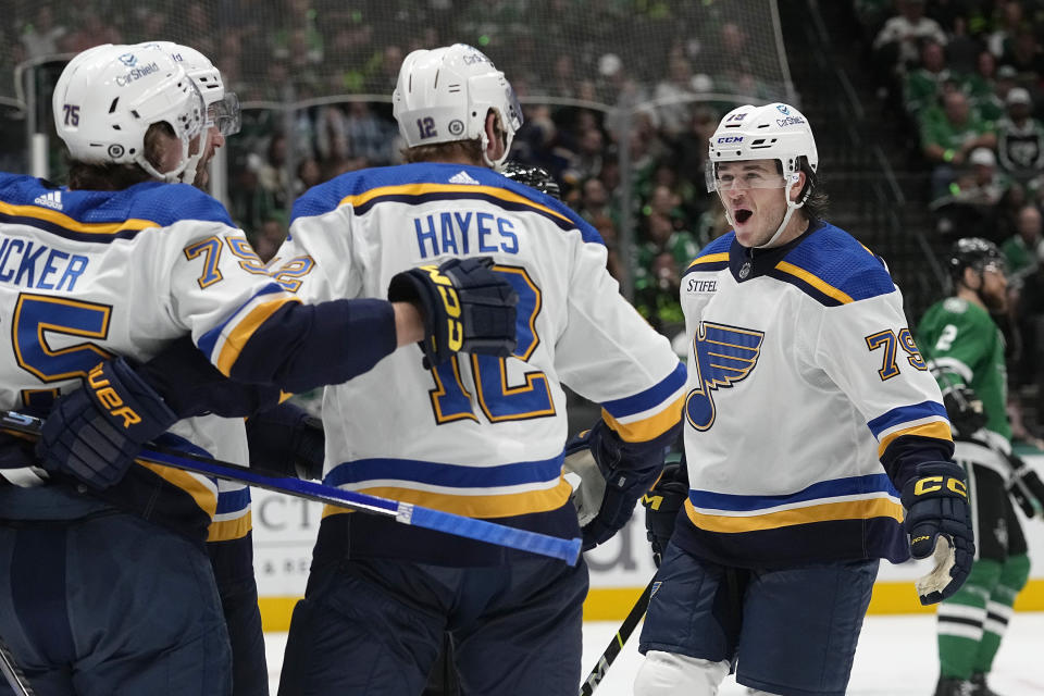 St. Louis Blues left wing Sammy Blais (79) celebrates after a goal with teammates Tyler Tucker (75) and Kevin Hayes (12) during the second period of an NHL hockey game against the Dallas Stars in Dallas, Thursday, Oct. 12, 2023. (AP Photo/LM Otero)