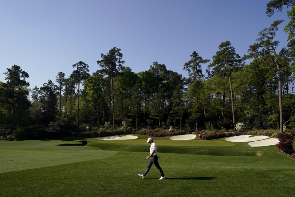 Rory McIlroy, of Northern Ireland, walks on the 14th hole during a practice round for the Masters golf tournament on Tuesday, April 6, 2021, in Augusta, Ga. (AP Photo/Charlie Riedel)