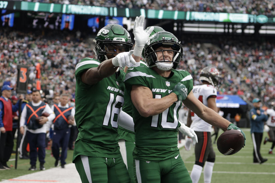 New York Jets' Braxton Berrios (10), right, celebrates his second touchdown with teammates during the first half of an NFL football game against the Tampa Bay Buccaneers, Sunday, Jan. 2, 2022, in East Rutherford, N.J. (AP Photo/Corey Sipkin)