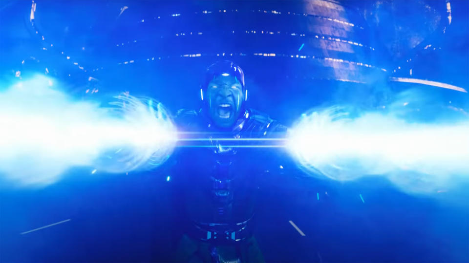 Kang screams as he unleashes two blue lazer beams in Ant-Man and the Wasp: Quantumania