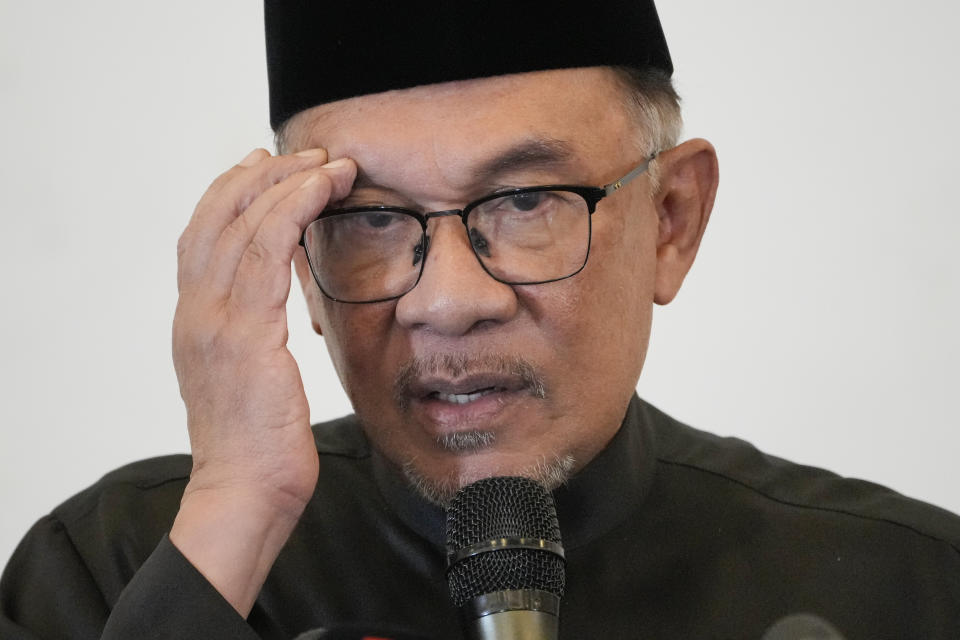 Malaysia's newly appointed Prime Minister Anwar Ibrahim delivers his speech during a gathering in Kuala Lumpur, Malaysia, Thursday, Nov. 24, 2022. Malaysia's king on Thursday named Anwar as the country's prime minister, ending days of uncertainty after the divisive general election produced a hung Parliament. (AP Photo/Vincent Thian)