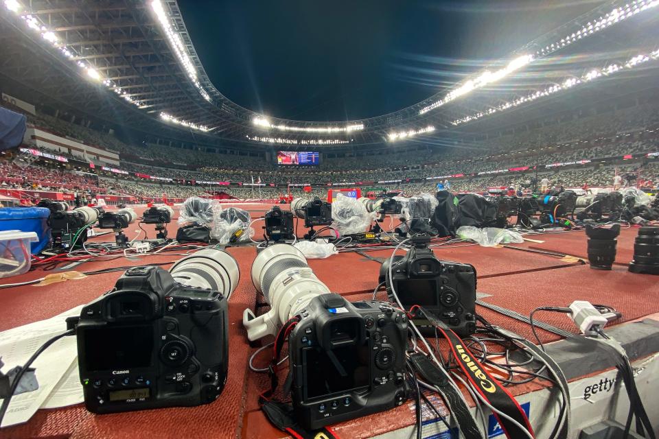 An abundance of cameras are positioned on the track at Tokyo's Olympic Stadium.