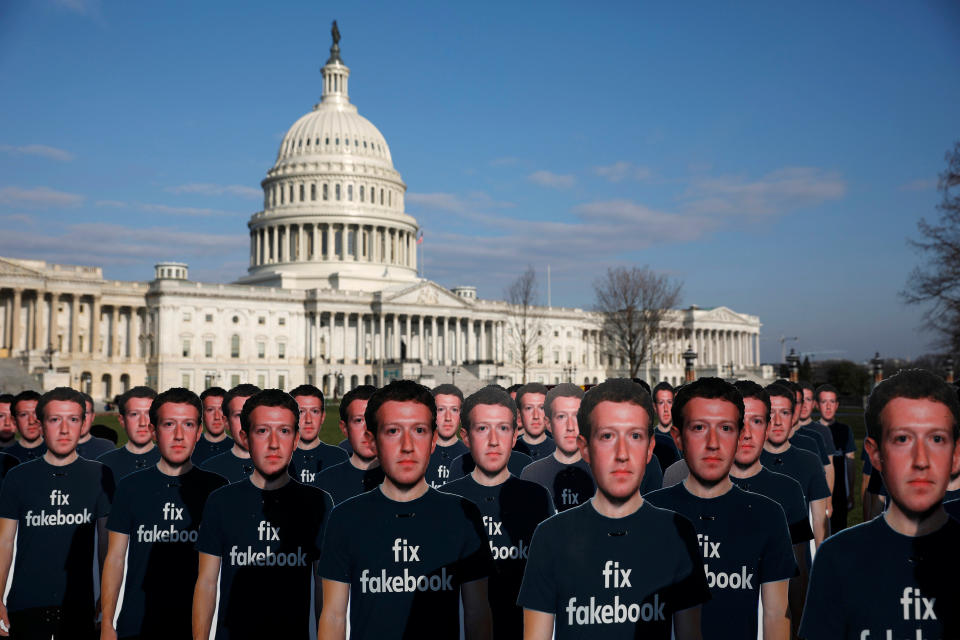 Dozens of cardboard cutouts of Facebook CEO Mark Zuckerberg are seen during an Avaaz.org protest outside the U.S. Capitol in Washington, U.S., April 10, 2018. REUTERS/Aaron P. Bernstein