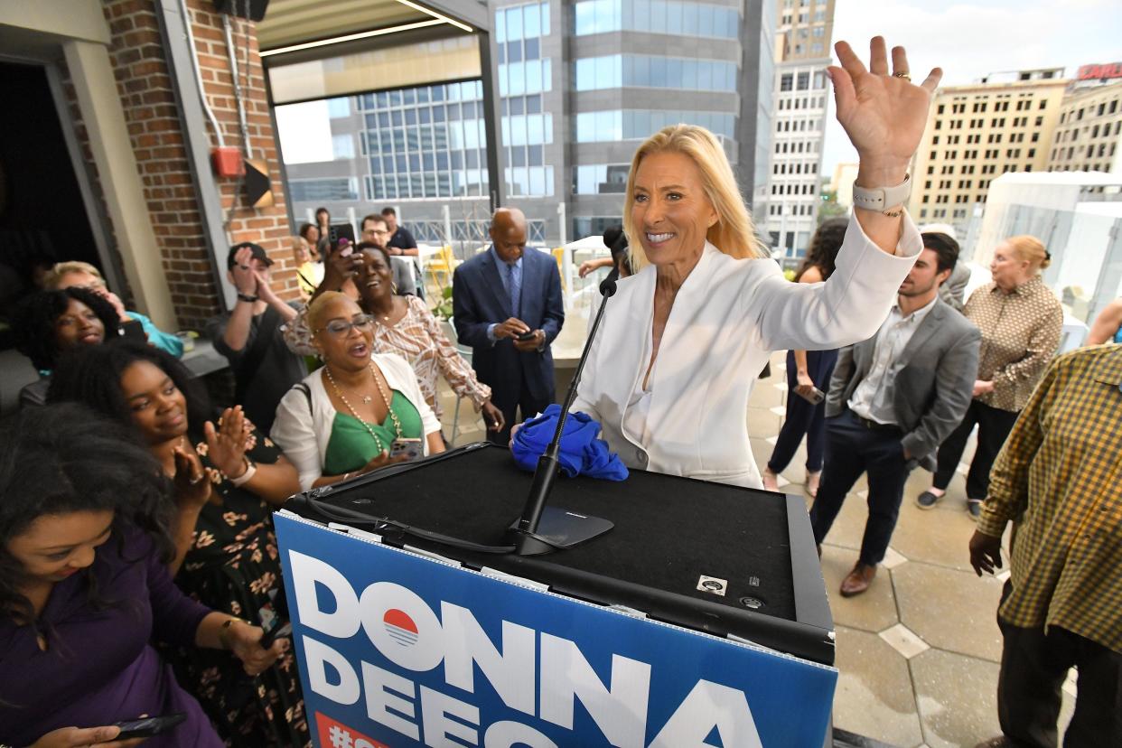 Donna Deegan waves to supporters following her election night speech Tuesday. Deegan, a Democrat, won the election over Republican Daniel Davis in the latest swing of the pendulum between Democratic and Republican candidates on the ballot in Duval County.