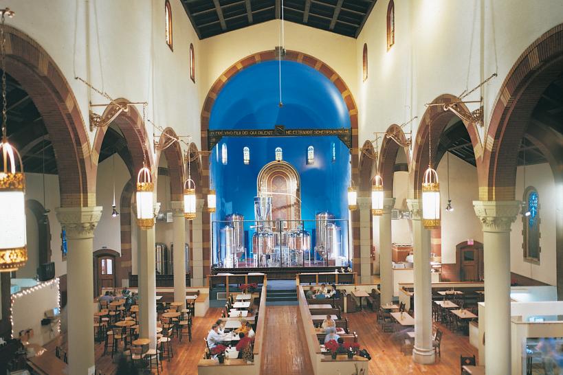 Brewing tanks line the walls at the altar