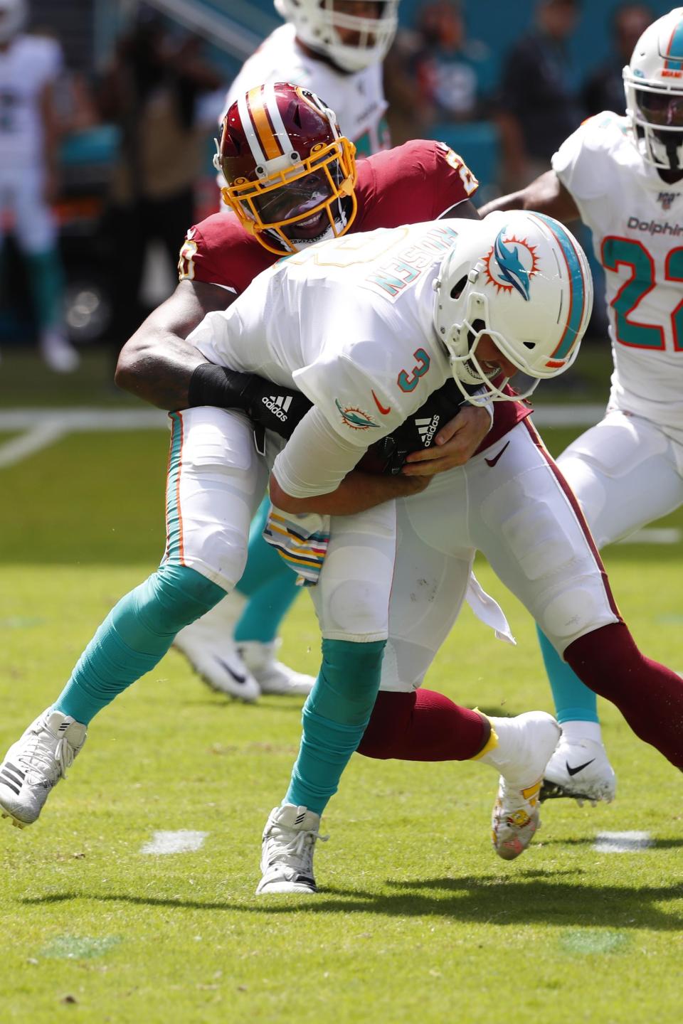 Washington Redskins strong safety Landon Collins (20) sacks Miami Dolphins quarterback Josh Rosen (3), during the first half at an NFL football game, Sunday, Oct. 13, 2019, in Miami Gardens, Fla. (AP Photo/Wilfredo Lee)