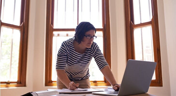 An insurance agent prepares a proposal for her clients