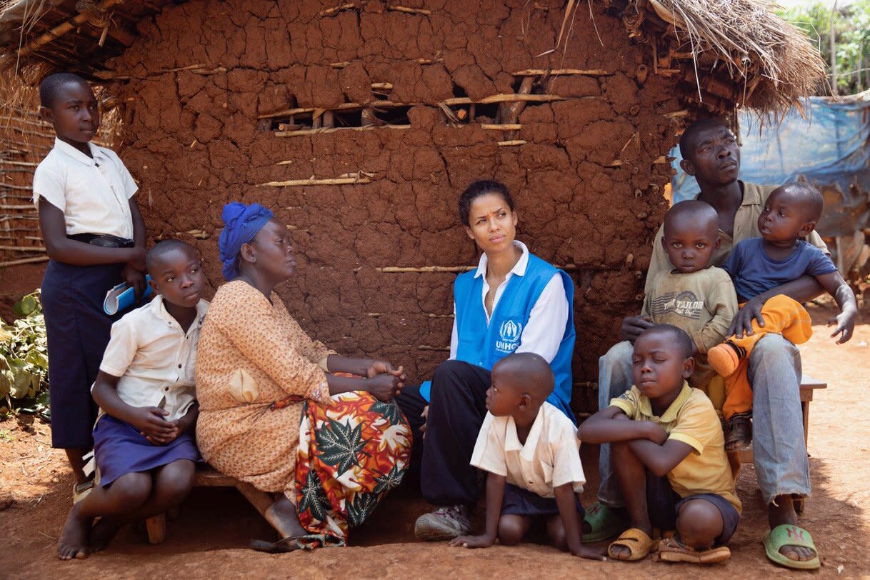 Kalehe, South Kivu, Democratic Republic of the Congo. UNHCR Goodwill Ambassador Gugu Mbatha-Raw visits a resettlement site in Kahele, Democratic Replublic of the Congo. Gugu sits with Vicky and her family in the resettlement site in Kahele who have the difficult choice of which child to send to school as they cannot afford to send all of them. Those pictured wearing shirts attend school. The mother, Vicky, was never able to go to school herself and wishes she had. One of her sons has an issue with his eye which they cannot afford to get medics to look at. Vicky, alongside all the residents of this site are here because their village, a four hour walk away, flooded when a river burst its banks. ; The Democratic Republic of the Congo hosts one of the most complex humanitarian crises in the world, with 520,000 refugees and asylum-seekers and 5.6 million Internally Displaced Persons (IDPs), the largest internal displacement crisis in Africa. In addition, more than 1 million Congolese refugees and asylum-seekers are sheltered across the African continent. Around 76% of the population live in poverty and 27 million people are food insecure. For such a dire and long-running crisis, the humanitarian response is severely underfunded, at only 33% of the $225 million in UNHCR’s needs-based budget, as of the end of August 2022. Some of these costs could be avoided in future if there were funds now to help refugees in the country, and Congolese refugees outside the country, to return to their place of origin. For IDPs, underfunding has put protection (including women’s empowerment) and shelter (sustainable housing and settlements) at critical risk. Currently, only 33% of the operations in DRC are funded, with a $151 million funding gap.