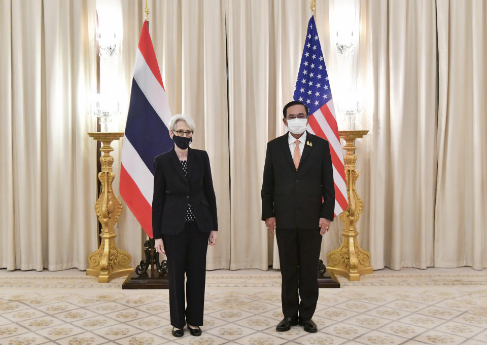 In this photo released by Government Spokesman Office, U.S. Deputy Secretary of State Wendy R. Sherman, left, and Thailand's Prime Minister Prayuth Chan-ocha, right, pose for photo, at Government House in Bangkok, Thailand, Wednesday, June 2, 2021. (Government Spokesman Office via AP)