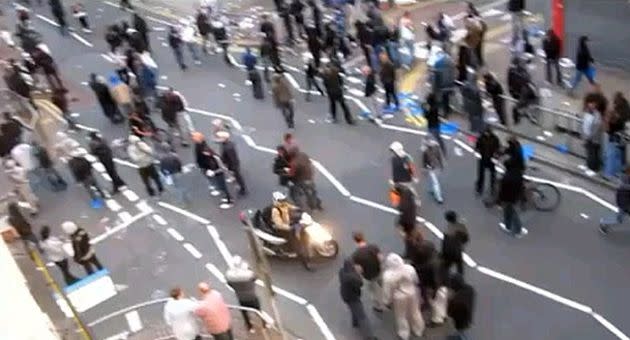 An unidentified man attempts to drive in a crowded London street. Photo: YouTube