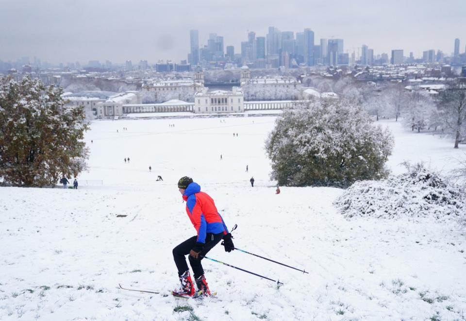 A person skis in the snow at Greenwich Park, London. Snow and ice have swept across parts of the UK (PA)