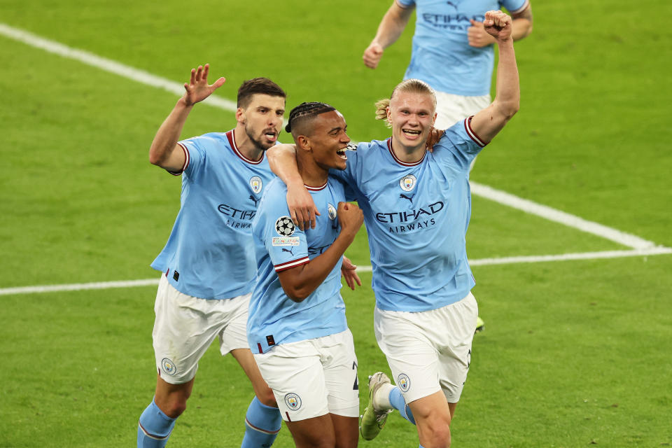 MANCHESTER, ENGLAND - MAY 17: Manuel Akanji of Manchester City celebates with teammates Ruben Dias and Erling Haaland after scoring the teams third goal during the UEFA Champions League semi-final second leg match between Manchester City FC and Real Madrid at Etihad Stadium on May 17, 2023 in Manchester, England. (Photo by Matt McNulty - Manchester City/Manchester City FC via Getty Images)