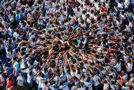 <p>Devotees form a human pyramid to celebrate the festival of Janmashtami, marking the birth anniversary of Hindu Lord Krishna, in Mumbai, India Aug. 25, 2016. (Photo: Shailesh Andrader/Reuters)</p>