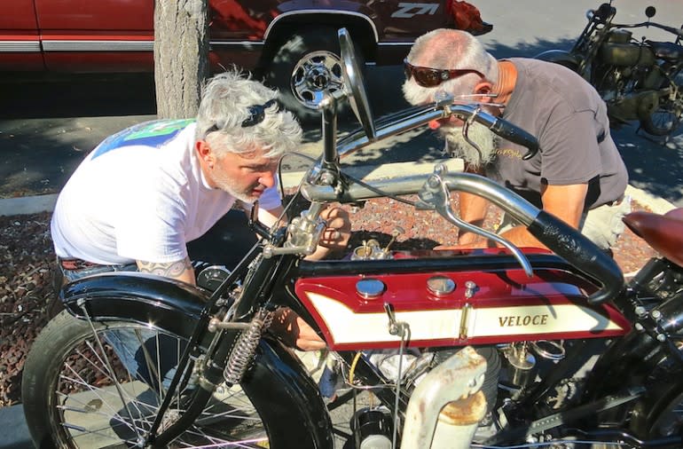 Pete Young (left) and Steve Huntzinger sort out some fuel delivery issues on Young's 1913 Veloce 3.5-hp single. The veteran of the Pioneer Run from London to Brighton and the Irish National Rally, has direct belt drive, no gears or clutch, and must be bump-started at every stop.