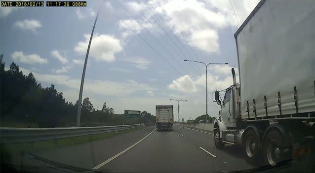 The car can be seen passing the truck on the right. Source: Facebook/ Dash Cam Owners Australia