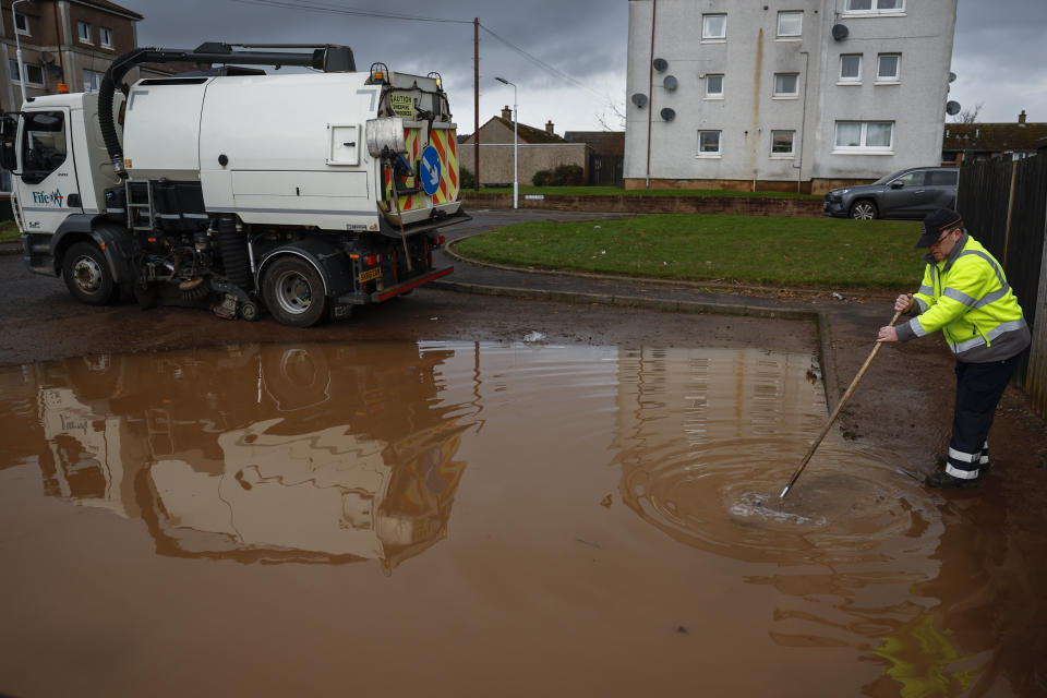 CUPAR, SCOTLAND - DECEMBER 28: Residents in the Kinloss Park area start to clear up following the affects of Storm Gerrit on December 28, 2023 in Cupar, Scotland. Almost 8,000 homes are still without power following yesterdays storm which brought blizzards and flooding to many parts Scotland. (Photo by Jeff J Mitchell/Getty Images)