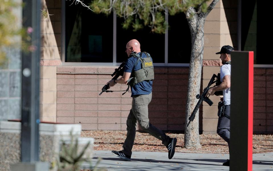 Law enforcement officers head into UNLV campus after reports of an active shooter in Las Vegas, Nevada, US 6 December 2023 (Reuters)