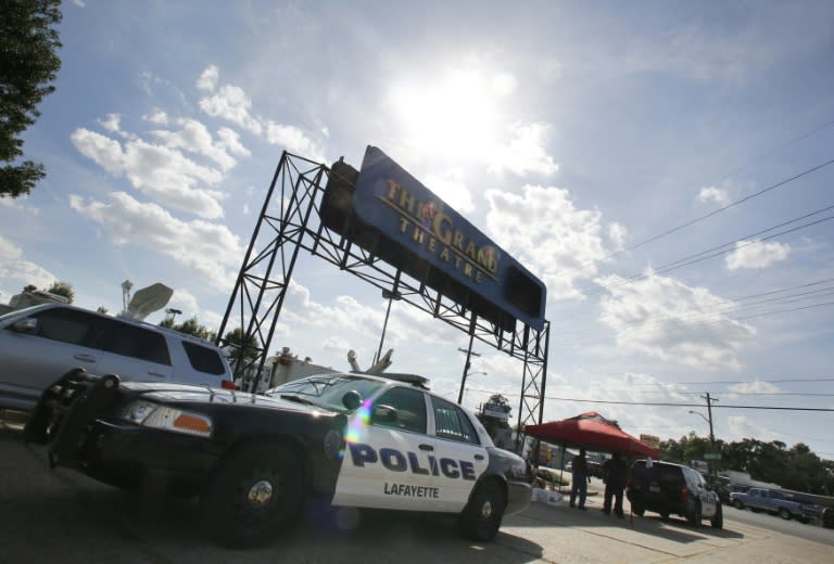 A police car stands outside The Grand Theatre on July 24, 2015 in Lafayette, Louisiana, following a deadly shooting the night before