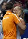 Kiki Bertens of the Netherlands is congratulated by captain Paul Haarhuis after defeating Russia's Svetlana Kuznetsova in their Fed Cup World Group tennis match in Moscow, February 7, 2016. REUTERS/Grigory Dukor