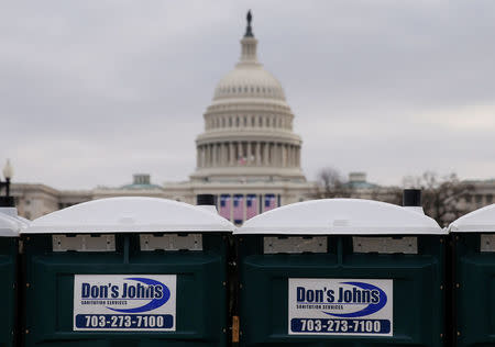 Portable restrooms near the U.S. Capitol building are seen with the company's name Don's Johns uncovered while some of the toilets have had the name covered with tape to block the words in Washington, U.S., January 19, 2017. REUTERS/Shannon Stapleton