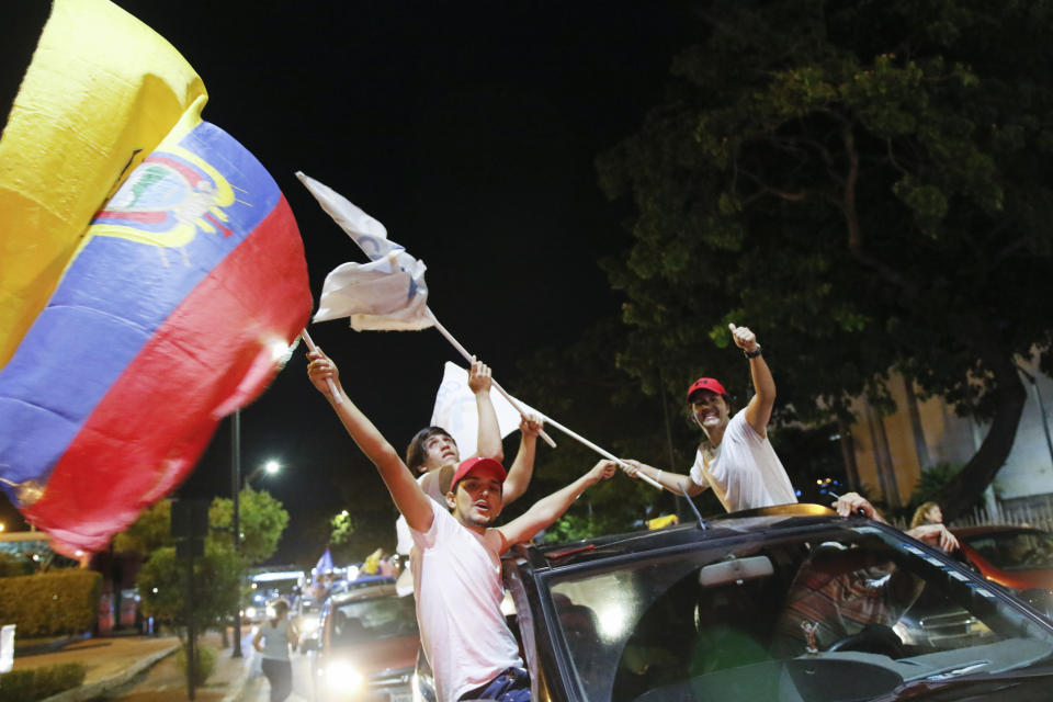 Supporters of Guillermo Lasso, candidate of Creating Opportunities party or CREO, celebrate in Guayaquil, Ecuador, Sunday, April 11, 2021. Lasso, a former banker, won a runoff presidential election beating economist Andres Arauz, an economist protege of former President Rafael Correa.(AP Photo/Angel Dejesus)