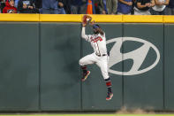 Atlanta Braves center fielder Michael Harris II makes a catch at the wall on a ball hit by New York Mets' Brandon Nimmo during the third inning of a baseball game Saturday, Oct. 1, 2022, in Atlanta. (AP Photo/Brett Davis)