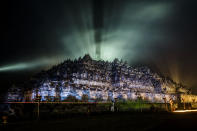 <p>The Borobudur temple seen illuminated during celebrations for Vesak Day on May 22, 2016 in Magelang, Central Java, Indonesia. Vesak is observed during the full moon in May or June with the ceremony centered around three Buddhist temples, pilgrims walk from Mendut to Pawon, ending at Borobudur. The holy day celebrates the birth, the enlightenment to nirvana, and the passing of Gautama Buddha’s, the founder of Buddhism. (Ulet Ifansasti/Getty Images) </p>