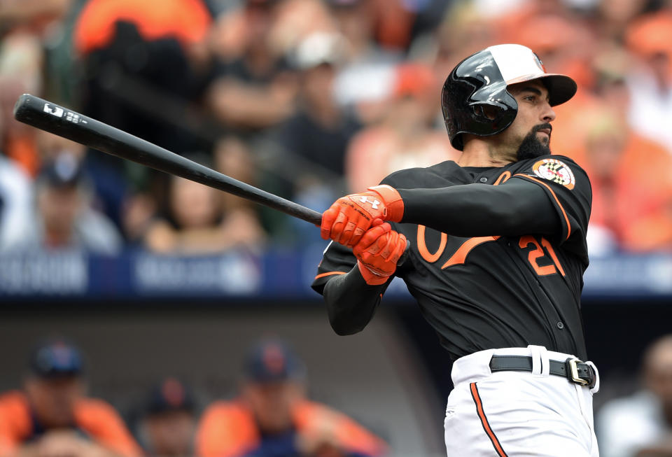 FILE - Baltimore Orioles' Nick Markakis watches his two-run home run in the third inning of Game 2 in baseball's AL Division Series against the Detroit Tigers in Baltimore, in this Friday, Oct. 3, 2014, file photo. Markakis has retired after a 15-year career spent with the Atlanta Braves and Baltimore Orioles. The 37-year-old Markakis, who was a free agent, told The Athletic in a story published Friday, March 12, 2021, that he was done playing after accumulating 2,388 hits, earning his lone All-Star bid in 2018 and coming within one win of reaching the World Series in his final season. (AP Photo/Nick Wass, File)