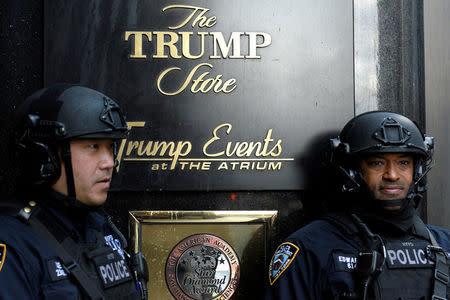 FILE PHOTO -- Heavily armed New York City Police (NYPD) officers stand guard in front of Trump Tower where Republican president-elect Donald Trump lives in the Manhattan borough of New York, U.S. on November 27, 2016. REUTERS/Darren Ornitz/File Photo