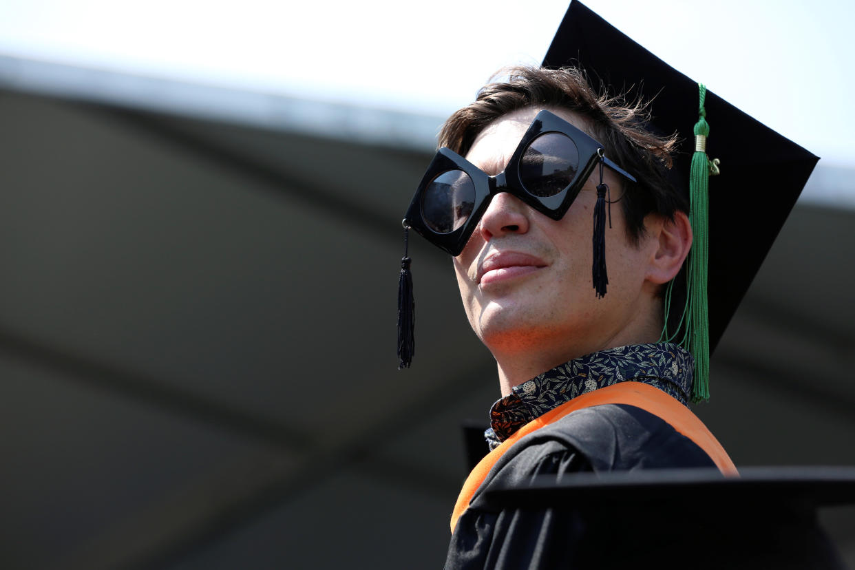 A graduate of The City College of New York stands in his seat at his commencement ceremony in Manhattan on May 31, 2019. REUTERS/Gabriela Bhaskar