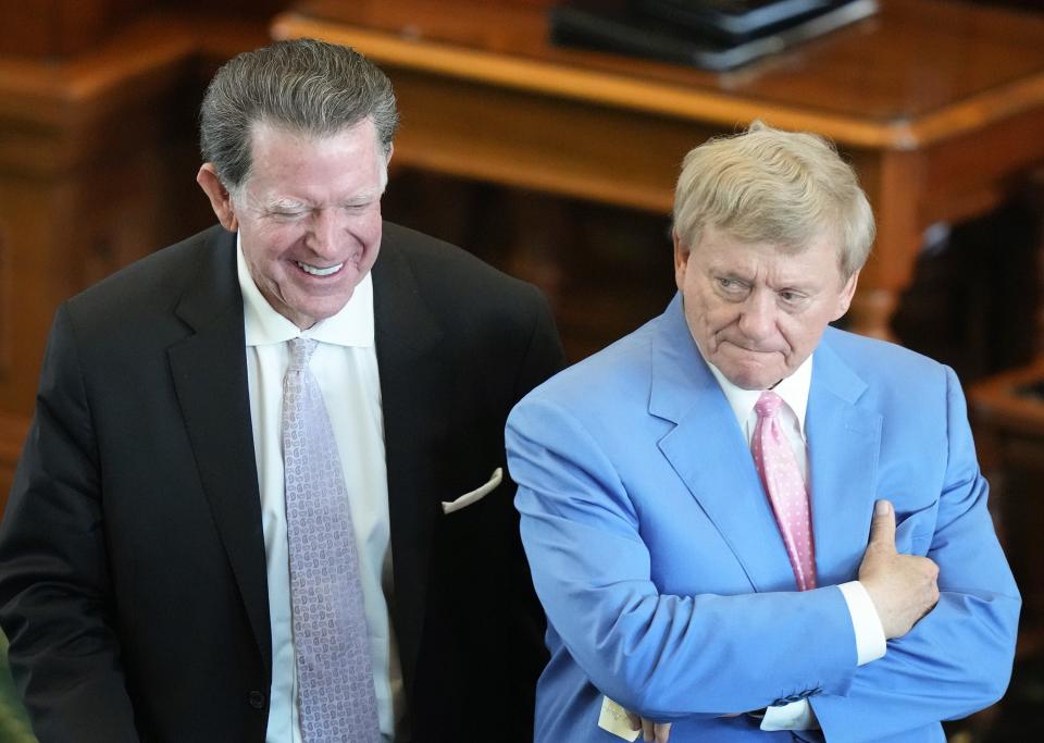 Opposing lawyers Dan Cogdell, left, and Rusty Hardin talk during a break Tuesday at the Senate impeachment trial of suspended Attorney General Ken Paxton.