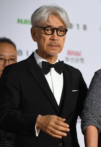 Japanese musician Ryuichi Sakamoto picked up the Asian Filmmaker of the Year award at the festival's opening on Friday night