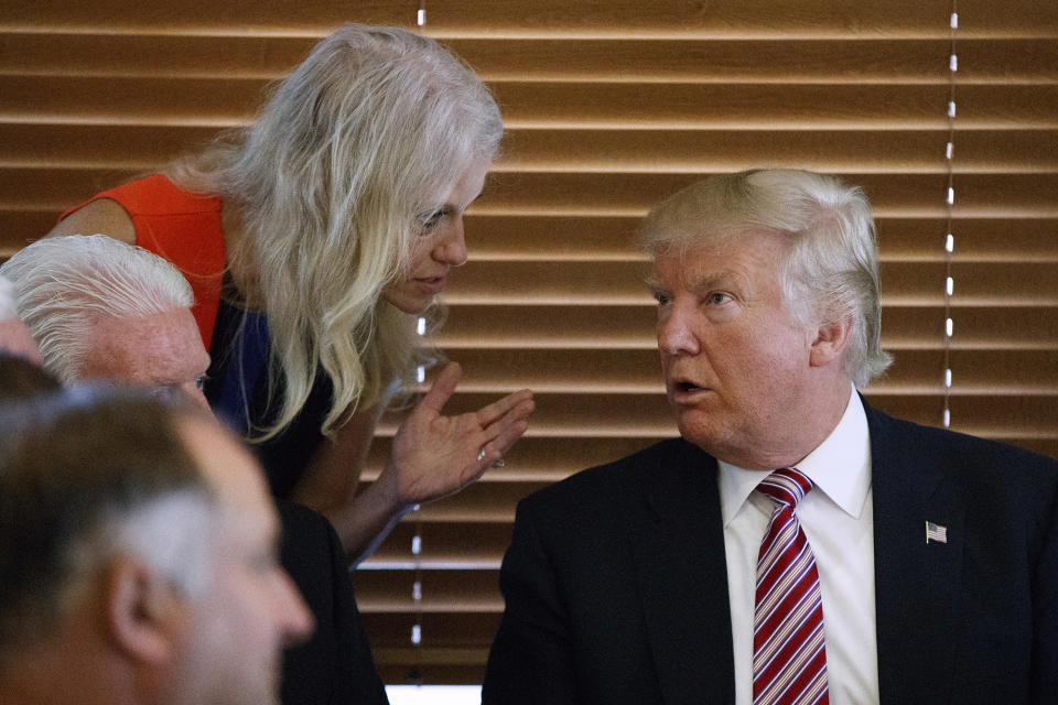 Republican presidential candidate Donald Trump talks with his campaign manager, Kellyanne Conway, during a visit to Goody's Restaurant in Brook Park, Ohio. (Photo: Evan Vucci/AP)