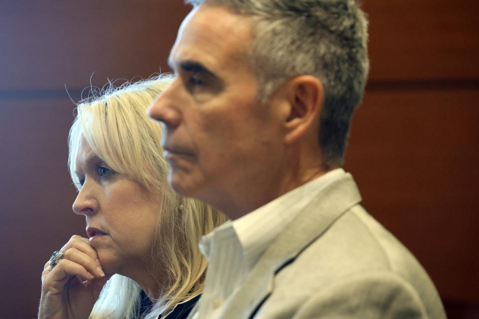 Gena Hoyer and her husband, Tom, attend a hearing at the Broward County Courthouse in Fort Lauderdale, Fla., Monday, Dec. 18, 2023. Hoyer's son, Luke, was killed in the 2018 shootings at Marjory Stoneman Douglas High School. (Amy Beth Bennett/South Florida Sun-Sentinel via AP, Pool)